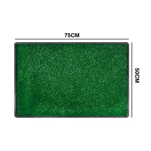 Green rectangular artificial turf or grass mat with black edging, shown on a white background with dimension lines indicating 75 cm by 50 cm at Pet Servo