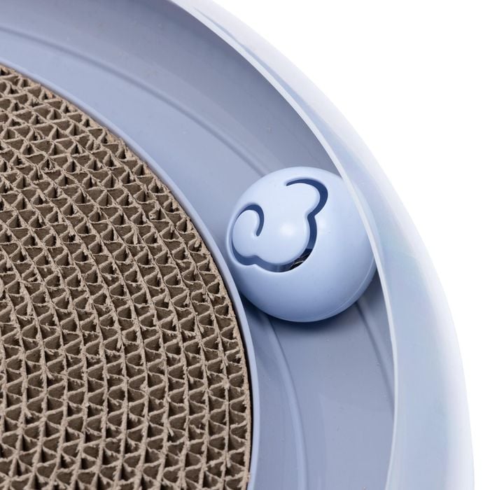 Close-up of a blue pet toy with a textured surface and a brand logo.