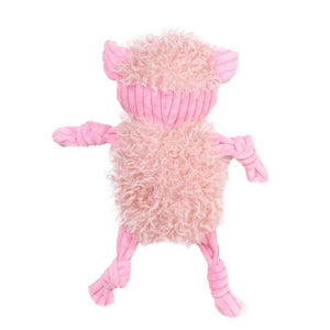Pink plush toy resembling a creature on a white background