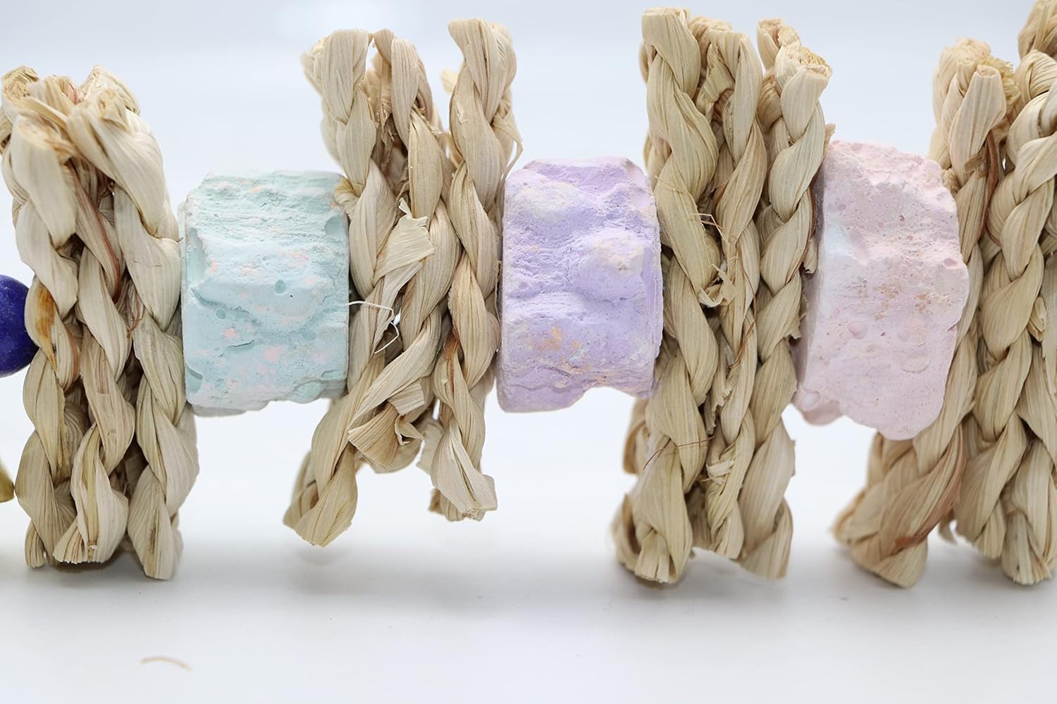 Woven bracelets with pastel-colored centers on a white background at Pet Servo