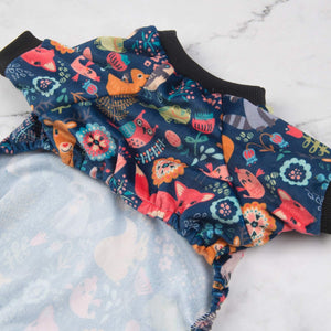 Colorful fabric with animal and floral patterns on a marble surface at Pet Servo