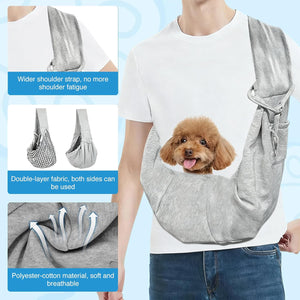 Person wearing a gray pet sling with a dog, showing features like wider shoulder strap and double-layer fabric at Pet Servo