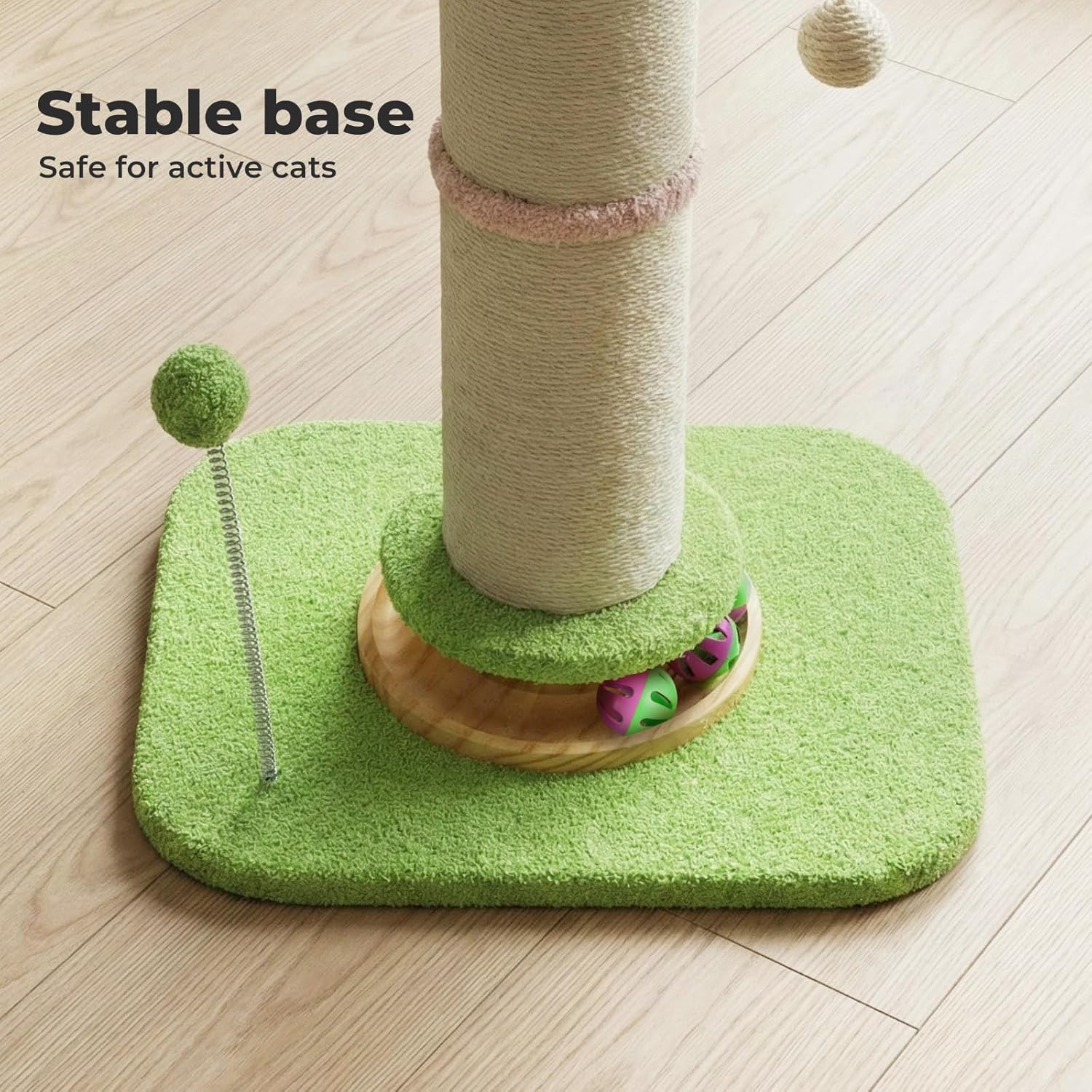 A cat tree with a tall sisal-wrapped post on a square green carpeted base, shown on a light wood floor. A text overlay in the top left reads 'Stable base Safe for active cats' at Pet Servo