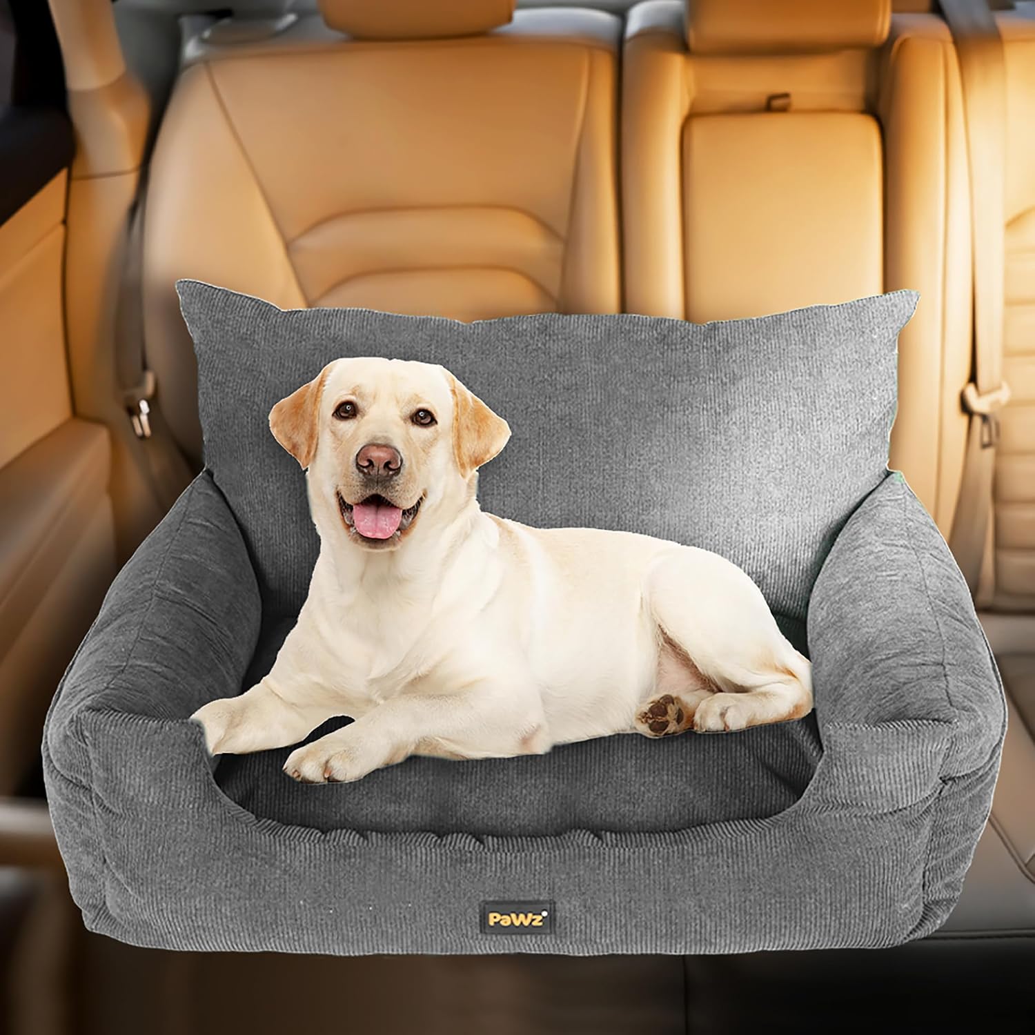 Dog lying on a gray pet seat cover in a car at Pet Servo