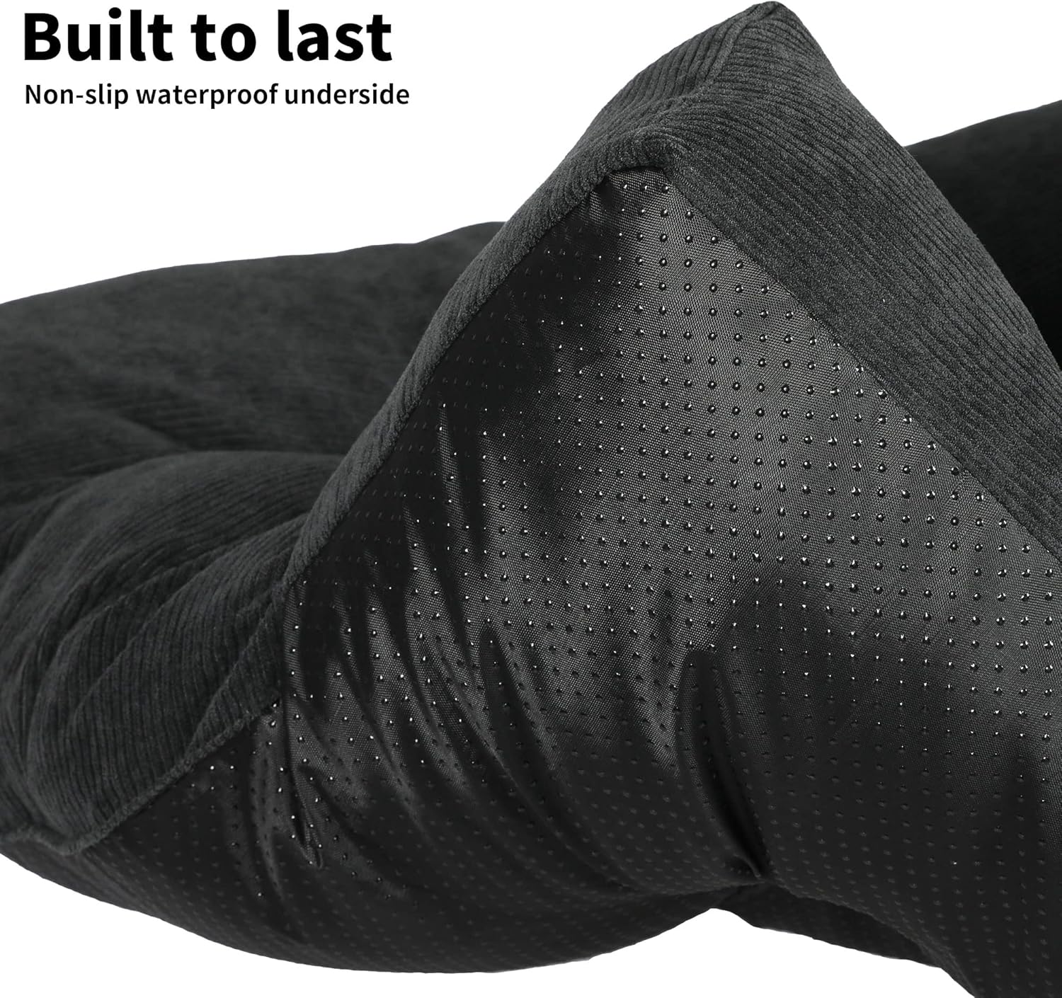 Close-up of a black textured surface with 'Built to last' and 'Non-slip waterproof underside' text at Pet Servo