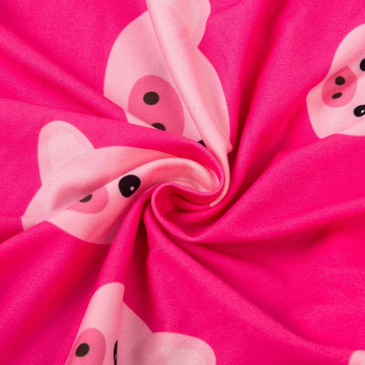 Bright pink fabric with a repeating cartoon pig print in light pink, shown gathered in a spiral to display the material and pattern at Pet Servo