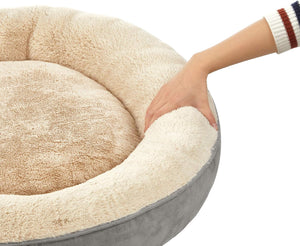 Round pet bed with a hand touching it, on a white background at Pet Servo