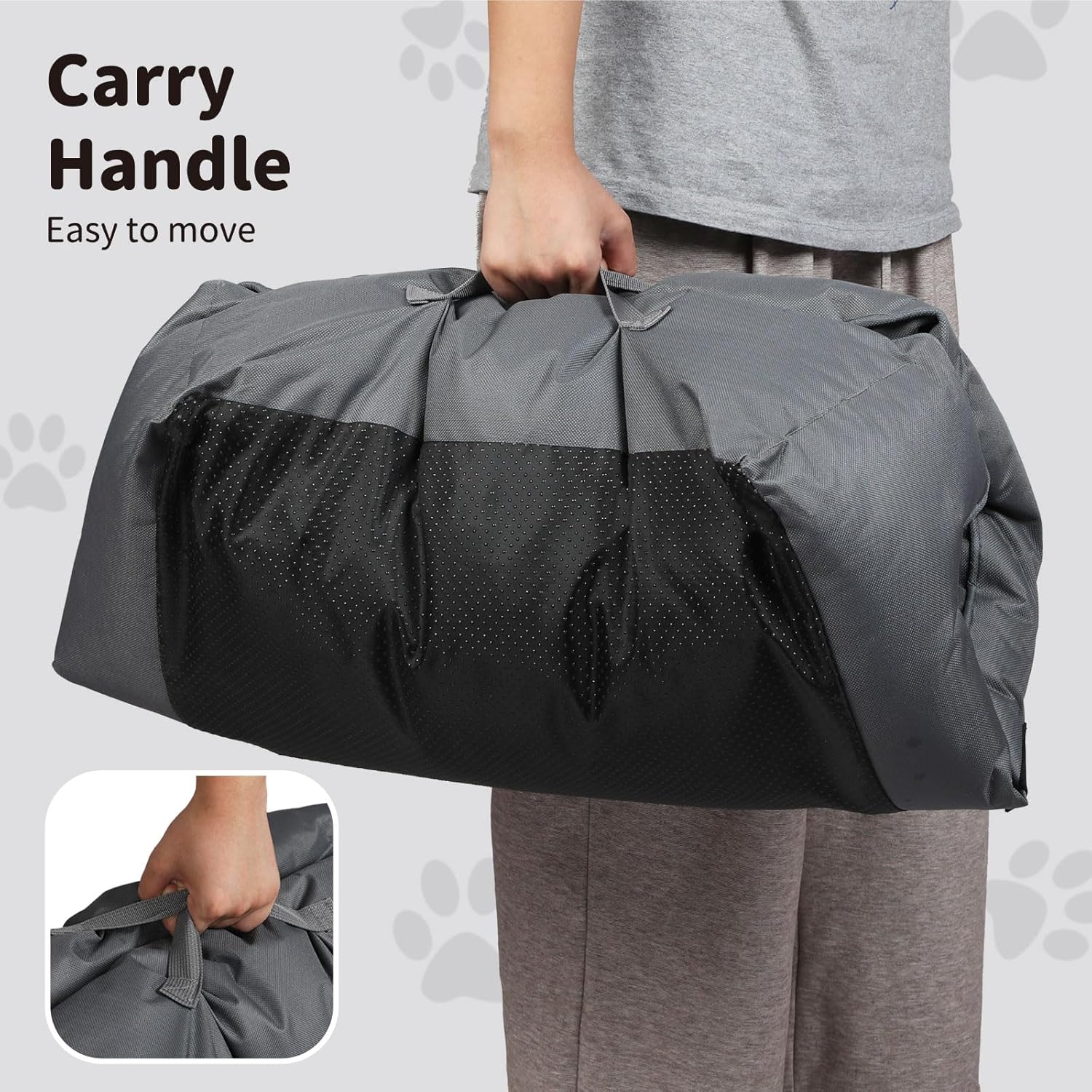 Person holding a large gray duffel bag with a carry handle, on a light gray background at Pet Servo