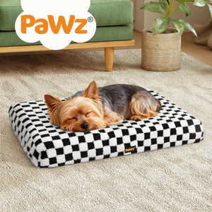 Dog sleeping on a checkered PaWz pet bed in a home setting at Pet Servo