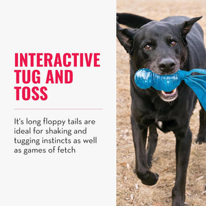 A black dog outdoors holding a bright blue tug toy in its mouth, with text on the left reading 'INTERACTIVE TUG AND TOSS' and additional descriptive copy at Pet Servo
