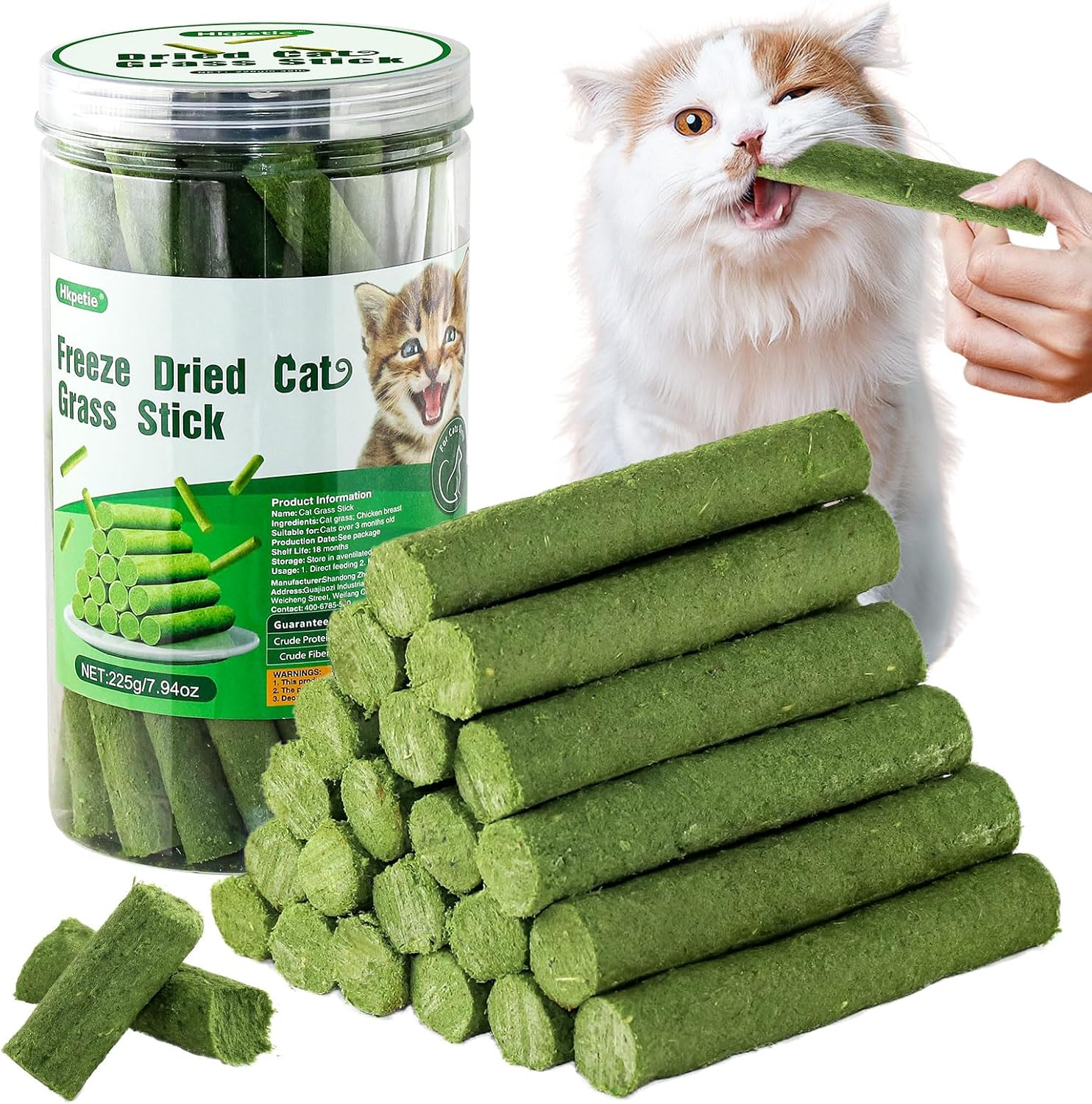 Green freeze-dried cat grass sticks with a jar and a cat eating one at Pet Servo