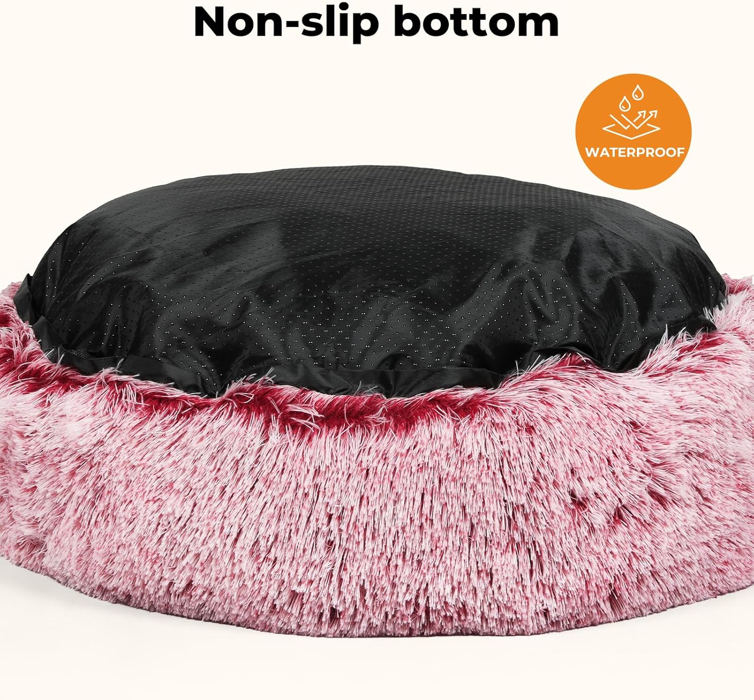 A pet bed with a fluffy pink faux-fur exterior and a black non-slip bottom, shown on a light beige background with text reading 'Non-slip bottom' and a circular 'Waterproof' badge at Pet Servo