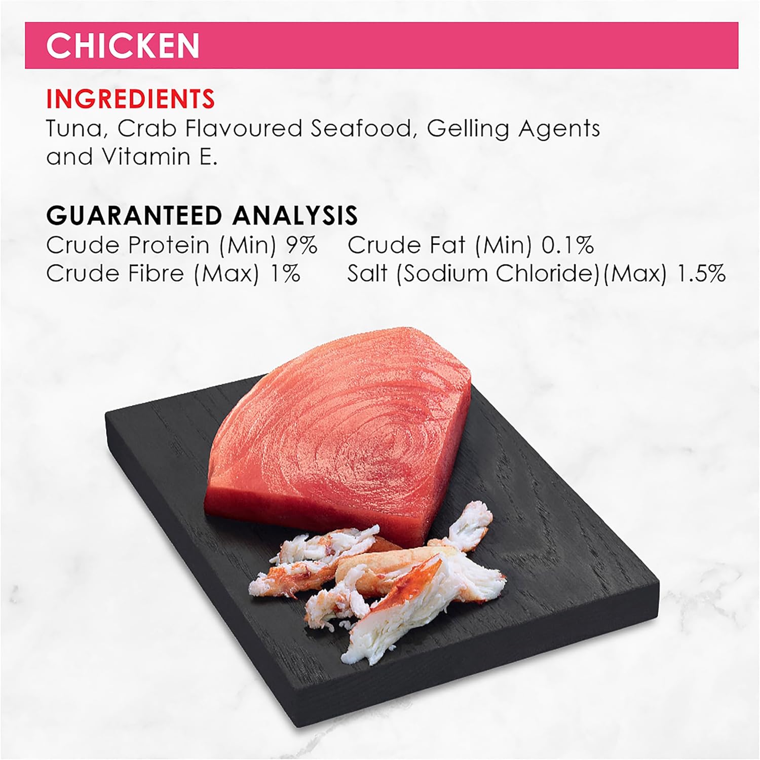Raw tuna and crab on a black slate with chicken ingredient and guaranteed analysis details at Petservo
