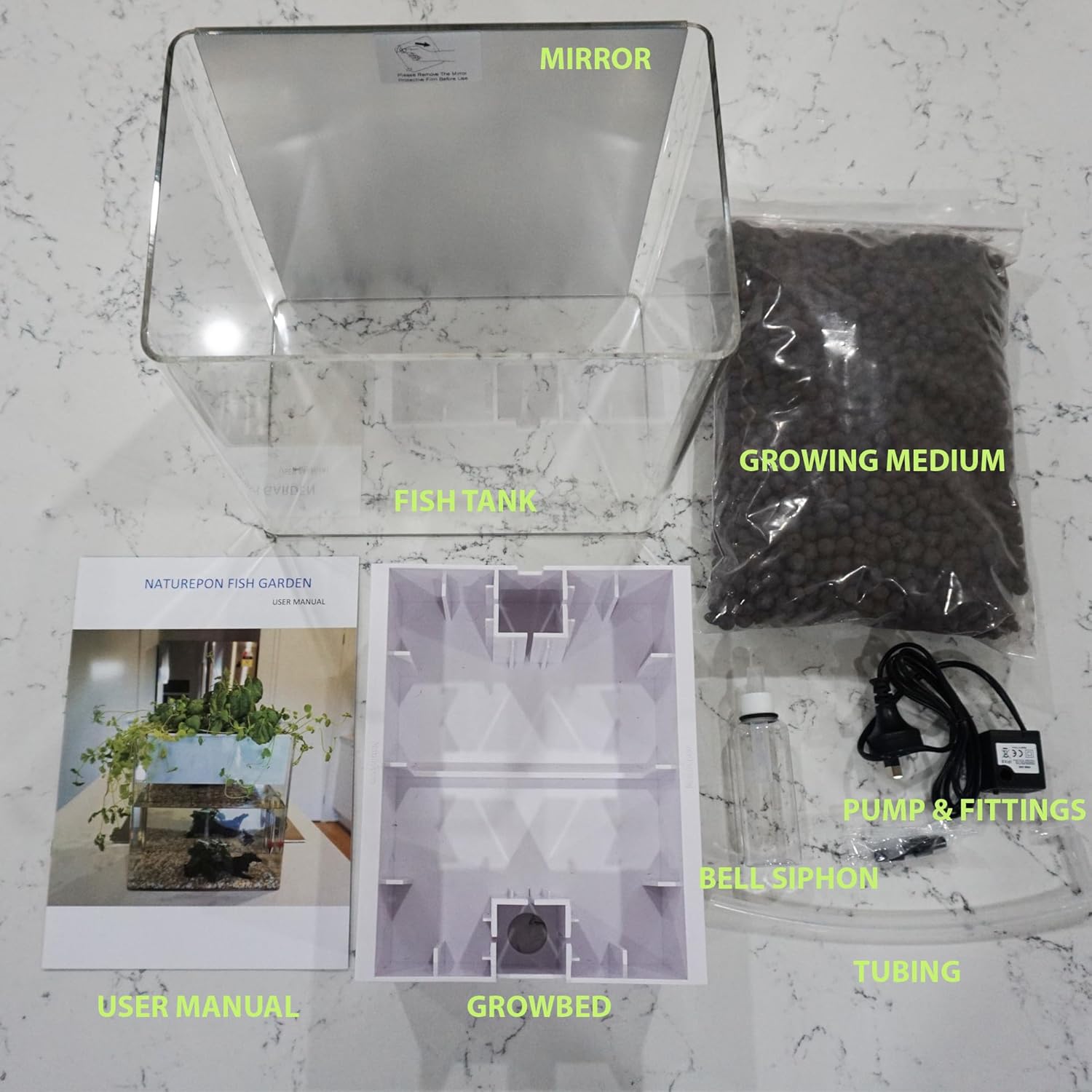 Fish tank setup kit with labeled components on a marble surface at Pet Servo