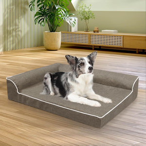 Dog lying on a gray pet bed in a modern living room at Pet Servo