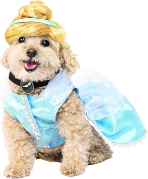 Dog wearing a Cinderella costume with a blue dress and yellow hairpiece on a white background at Pet Servo