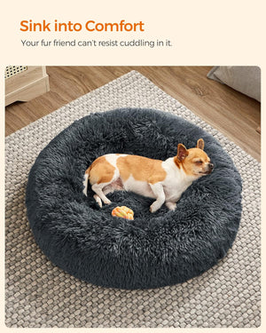 Dog lying on a fluffy donut bed with text 'Sink into Comfort' above at Pet Servo