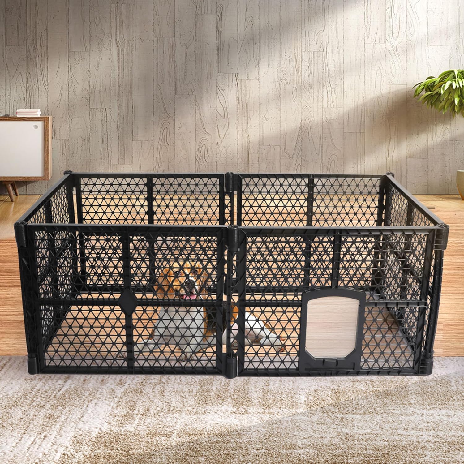 A black plastic pet playpen with a diamond-grid design and a hinged door, shown in a staged indoor room with a dog visible inside. The playpen is set on a textured rug against a wood-paneled wall at Pet Servo