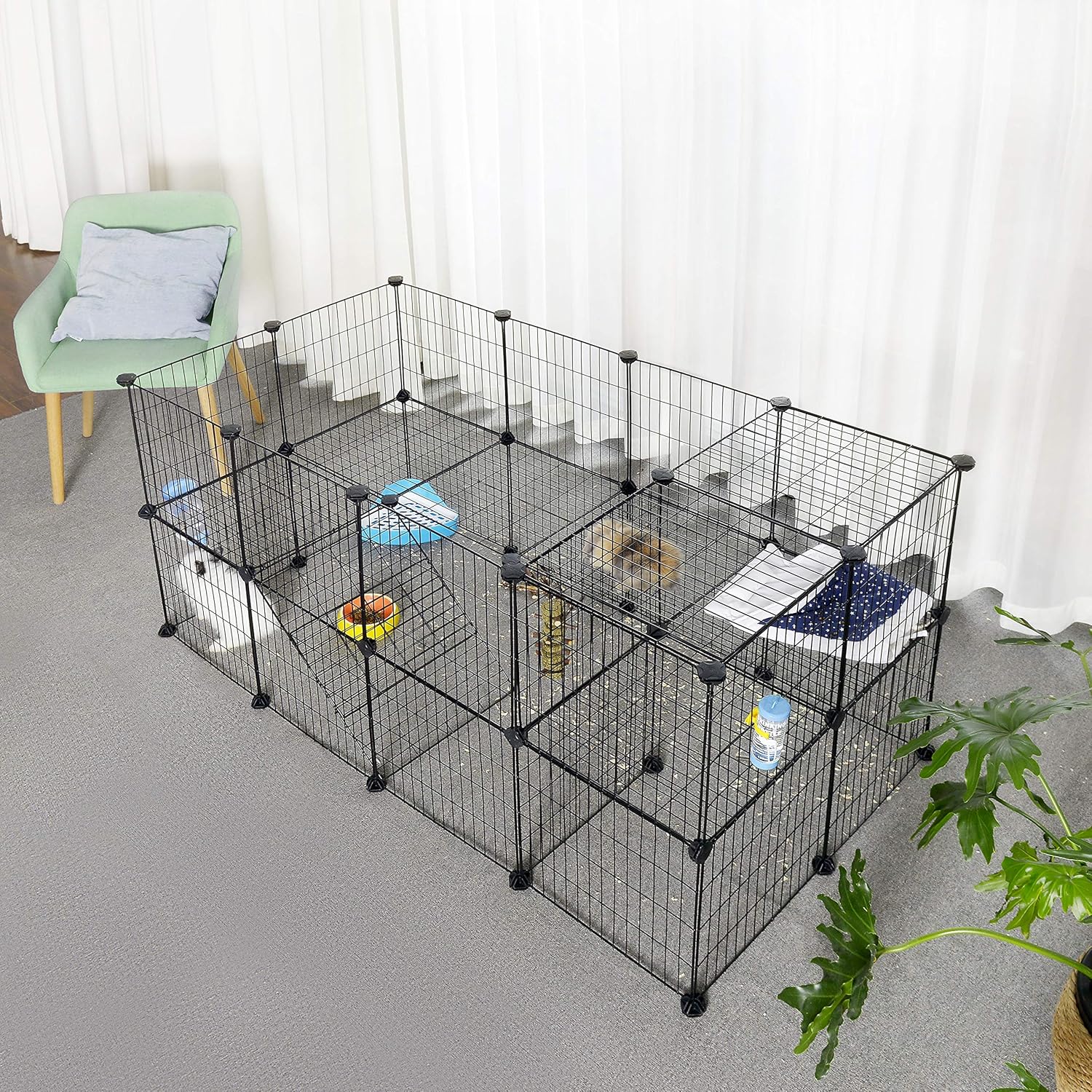 Pet playpen with various toys and items inside on a gray floor at Pet Servo