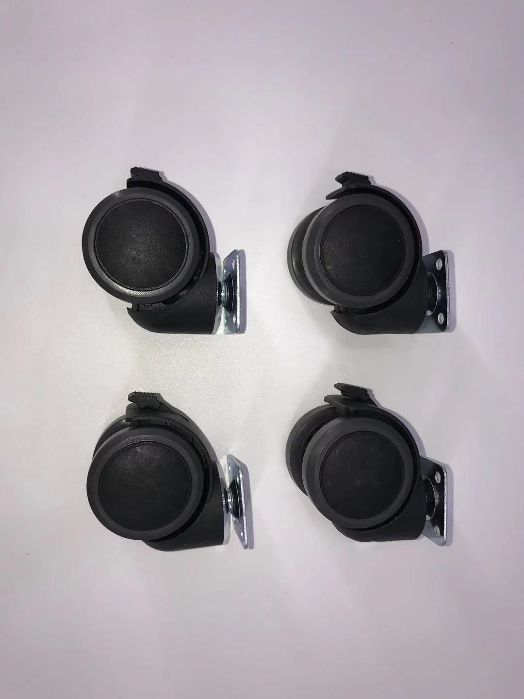 Four black caster wheels on a white background at Pet Servo