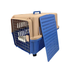 A plastic pet carrier with a beige upper body, blue lower base, blue handle, and a blue vented door panel leaning against the right side. The front has a wire mesh entry door at Pet Servo