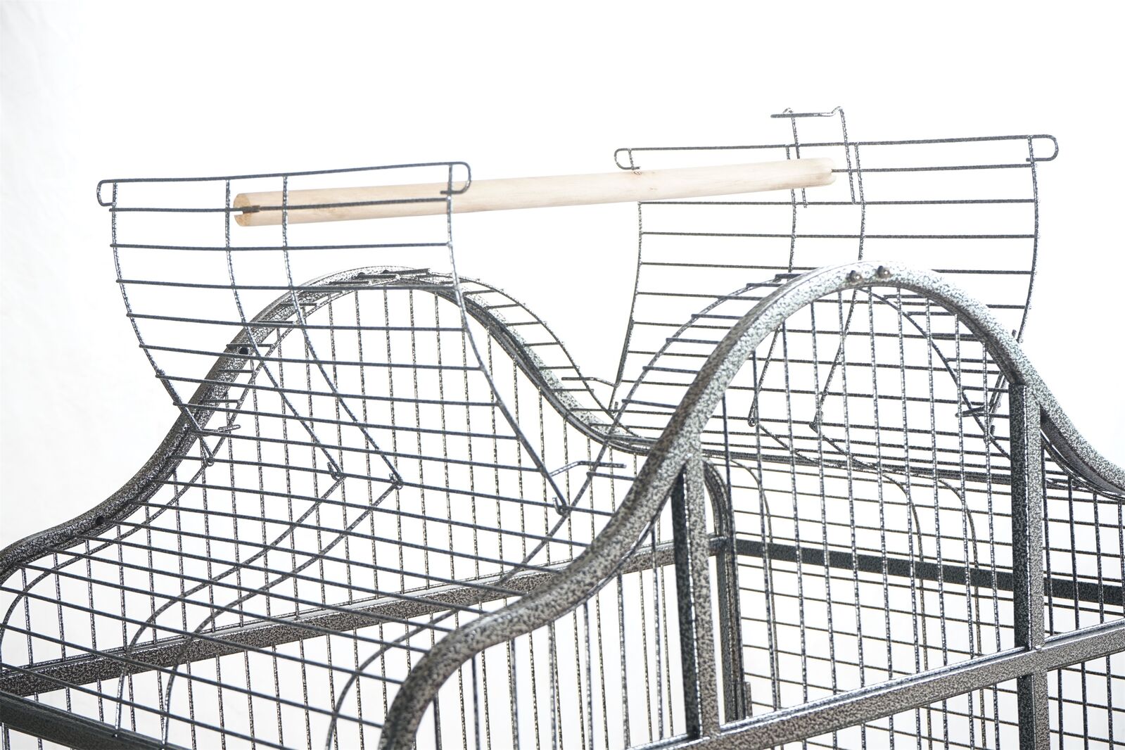 Metal wire bird cage with a white perch on a white background at Pet Servo