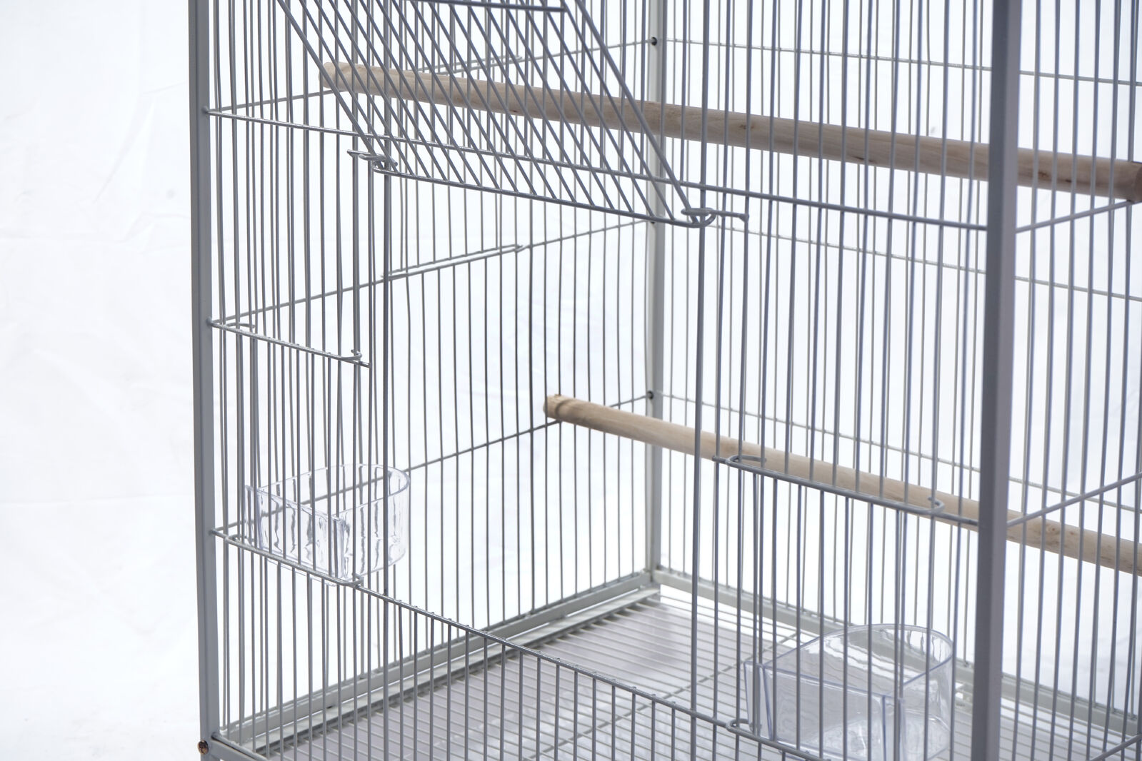 Bird cage with wire bars on a white background at Pet Servo