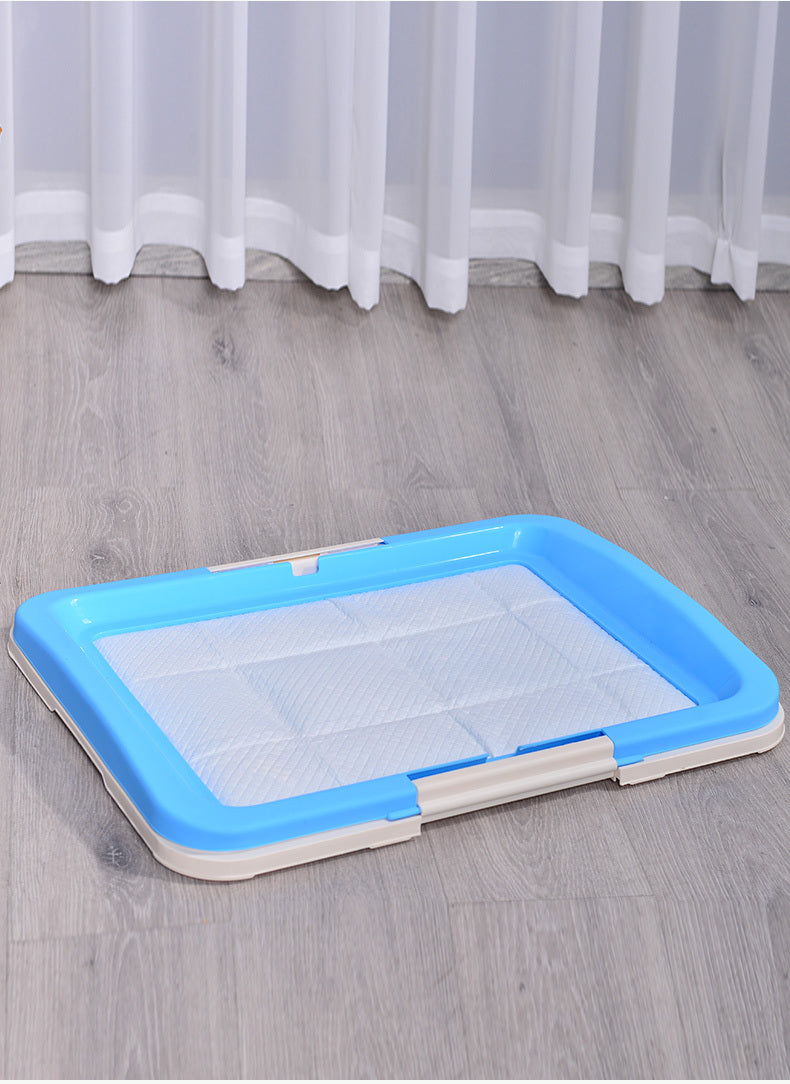 Rectangular pet pad with blue border on a wooden floor at Pet Servo