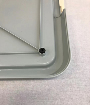 Gray plastic tray with a central hole on a light gray background at Pet Servo