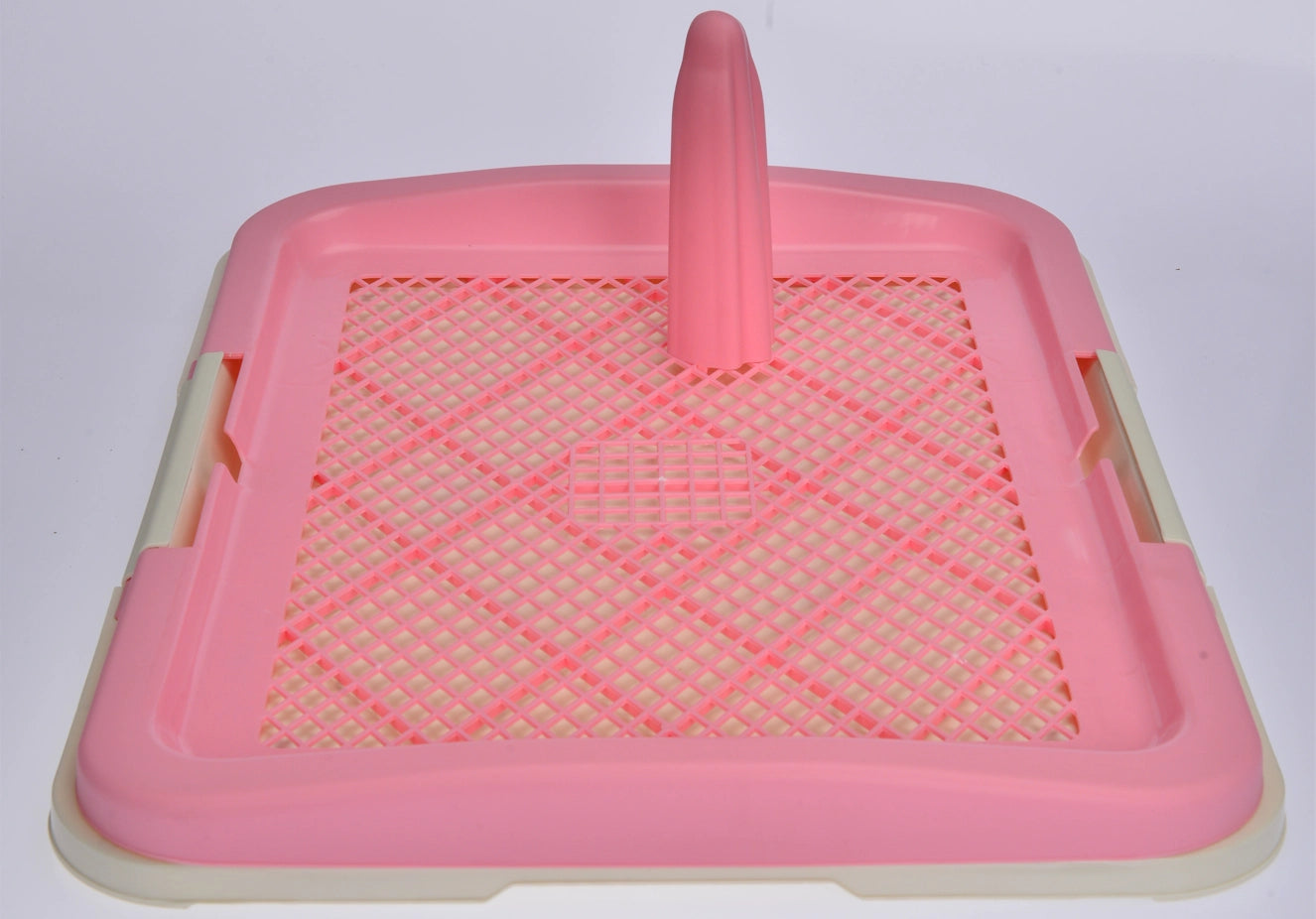 Pink plastic pet litter box with a raised center post and diamond-patterned bottom tray, shown on a plain light background at Pet Servo