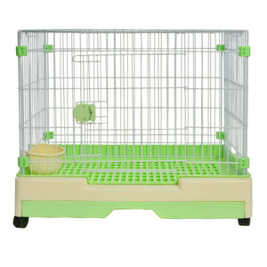 A small wire pet cage with a green plastic base, green trim, a green bottom tray, and a beige bowl, photographed on a plain white background at Pet Servo