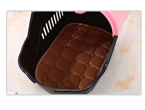 Brown quilted seat cover on a black vehicle seat with a pink interior at Pet Servo