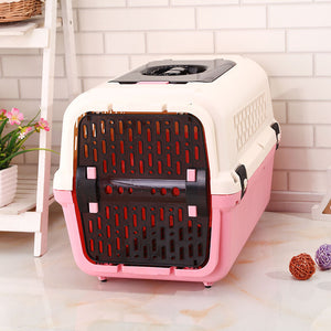 Pink and beige pet carrier on a light wooden floor with a white tiled wall background at Pet Servo