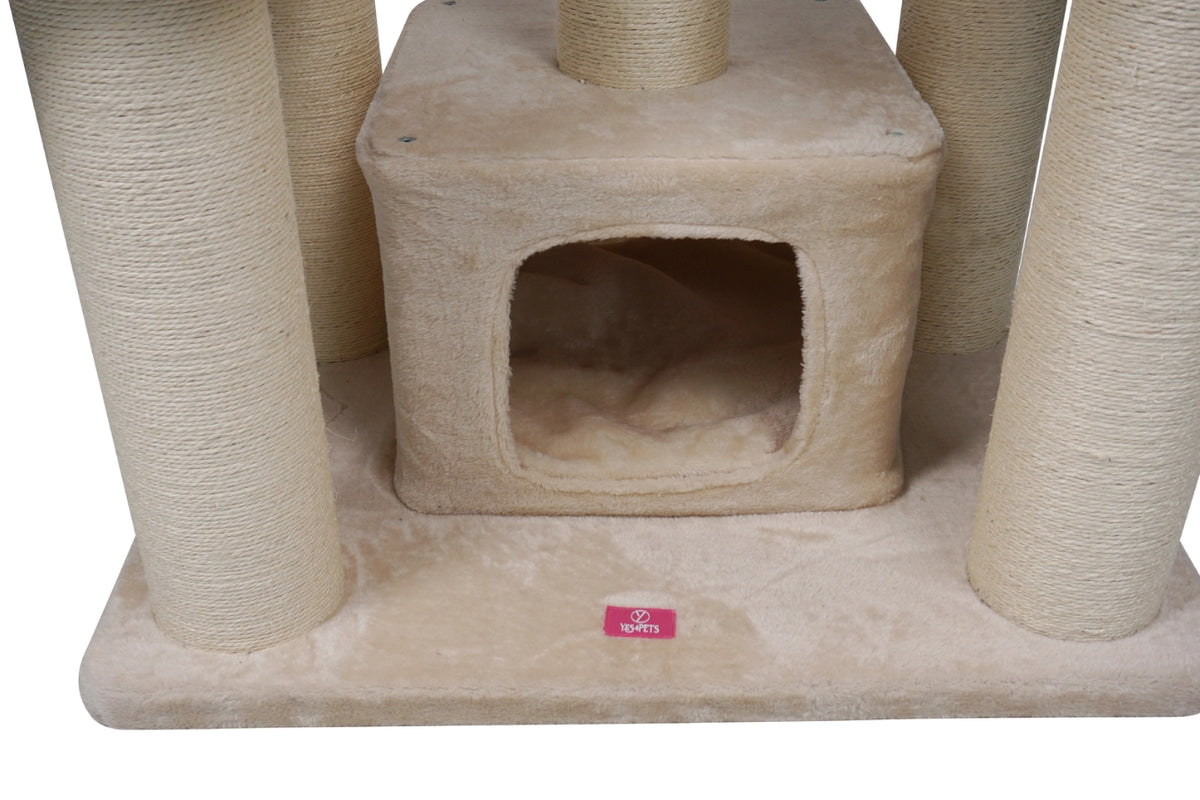 Beige carpeted cat tree with a central enclosed cubby, sisal-wrapped scratching posts, and a small red brand tag on the base at Pet Servo