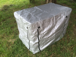 White storage bin with black zippers on a grassy ground at Pet Servo