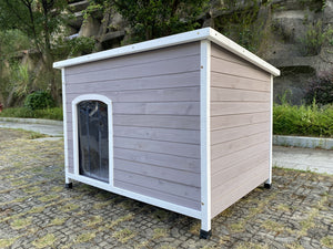 Wooden dog house with a white border on a stone pavement at Pet Servo