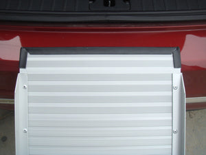 White rolling door on a red vehicle at Pet Servo