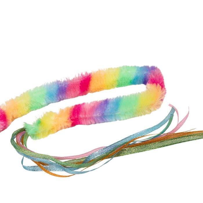 Multicolored fuzzy headband with ribbons on a white background