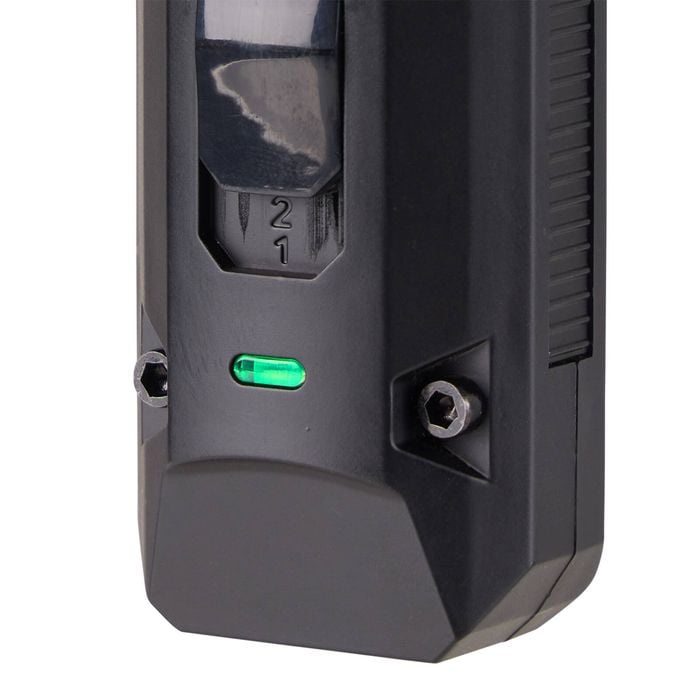 Black electronic device with a green light on a white background
