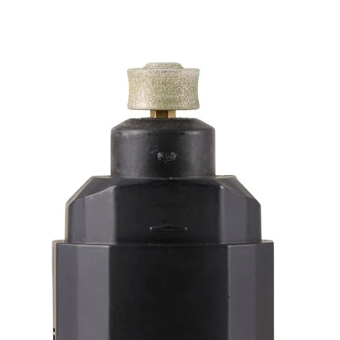 Black metal fitting with a textured cap on a white background