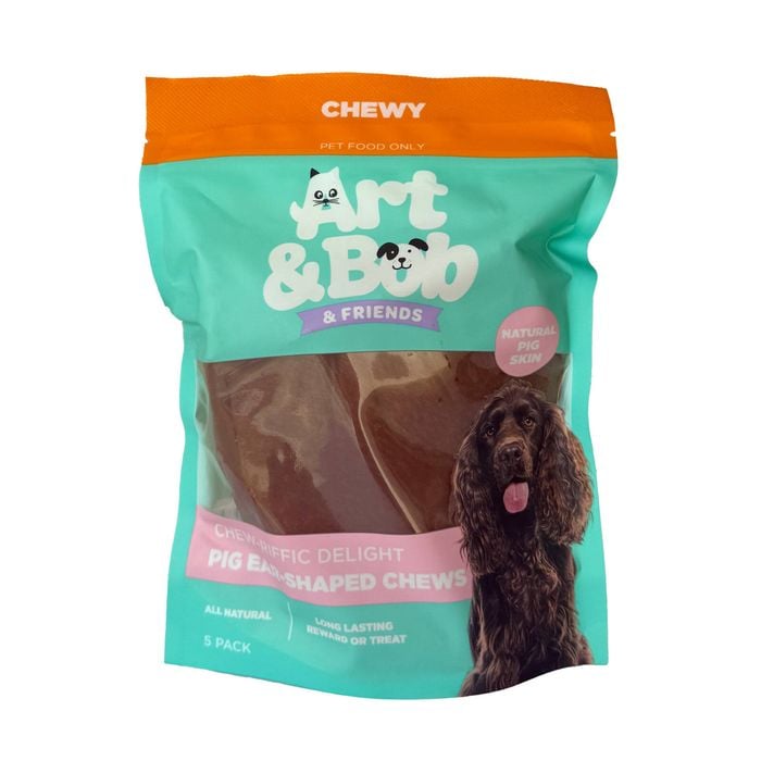 Packaging of Art & Bob & Friends dog treats with a dog on a white background