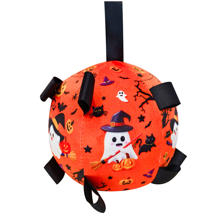 An orange Halloween-themed fabric ball toy with black hanging straps, featuring embroidered ghosts, pumpkins, bats, and witches on a white background.