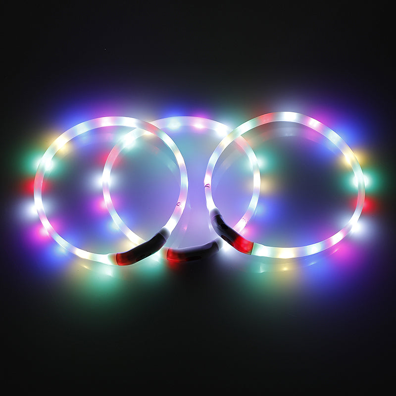 Three colorful LED dog collars on a black background at Pet Servo
