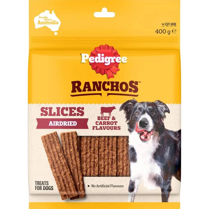 Pedigree Ranchos Slices Airdried dog treats in a 400 g bag. The packaging features a bright yellow top half, a cream lower half, a red Pedigree logo, and a black and white Border Collie dog on the right.