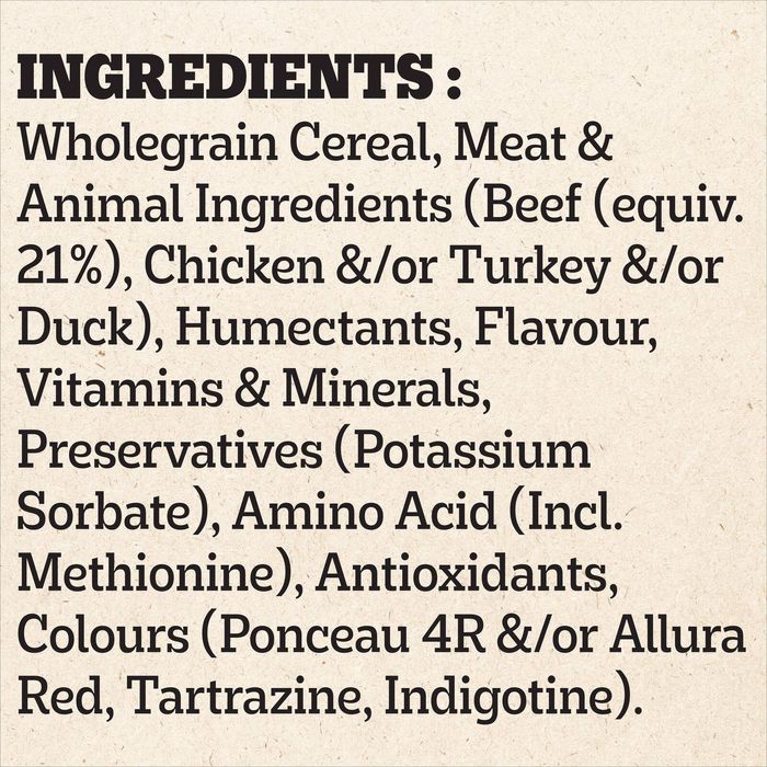 A text-based ingredients list on a light beige background, stating: INGREDIENTS: Wholegrain Cereal, Meat & Animal Ingredients (Beef (equiv. 21%), Chicken &/or Turkey &/or Duck), Humectants, Flavour, Vitamins & Minerals, Preservatives (Potassium Sorbate), Amino Acid (Incl.