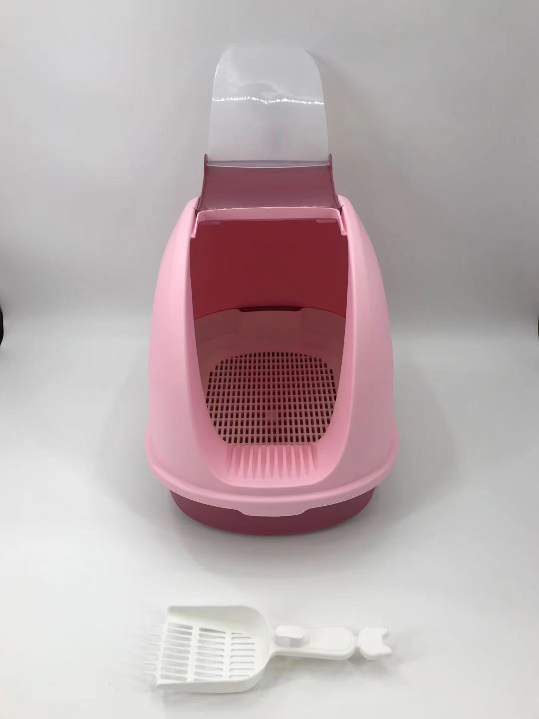 Pink cat litter box with a white scoop on a white background at Pet Servo