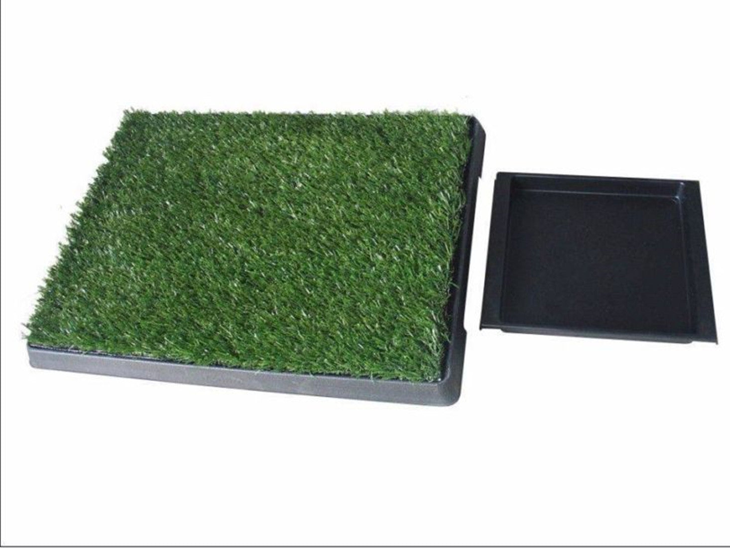 Pet toilet training pad with artificial grass surface and black base on a white background at Pet Servo