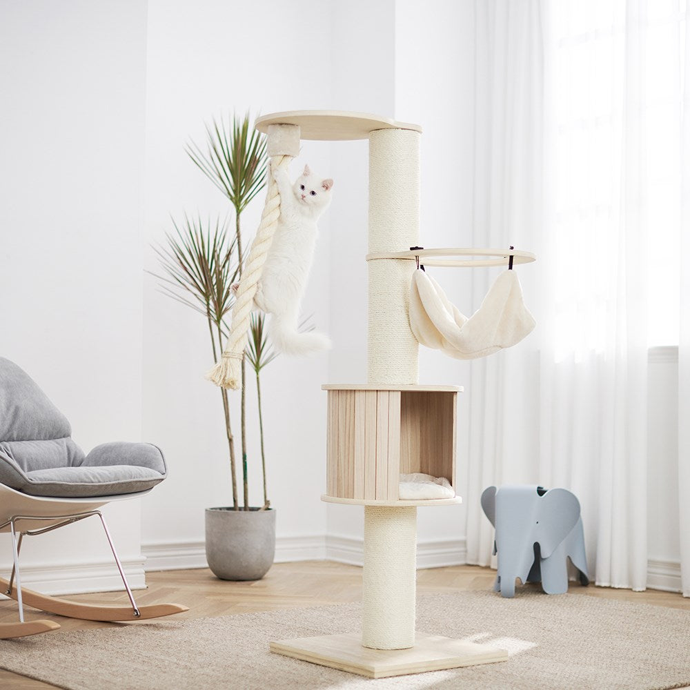 Cat tree with a hammock in a modern living room setting at Pet Servo