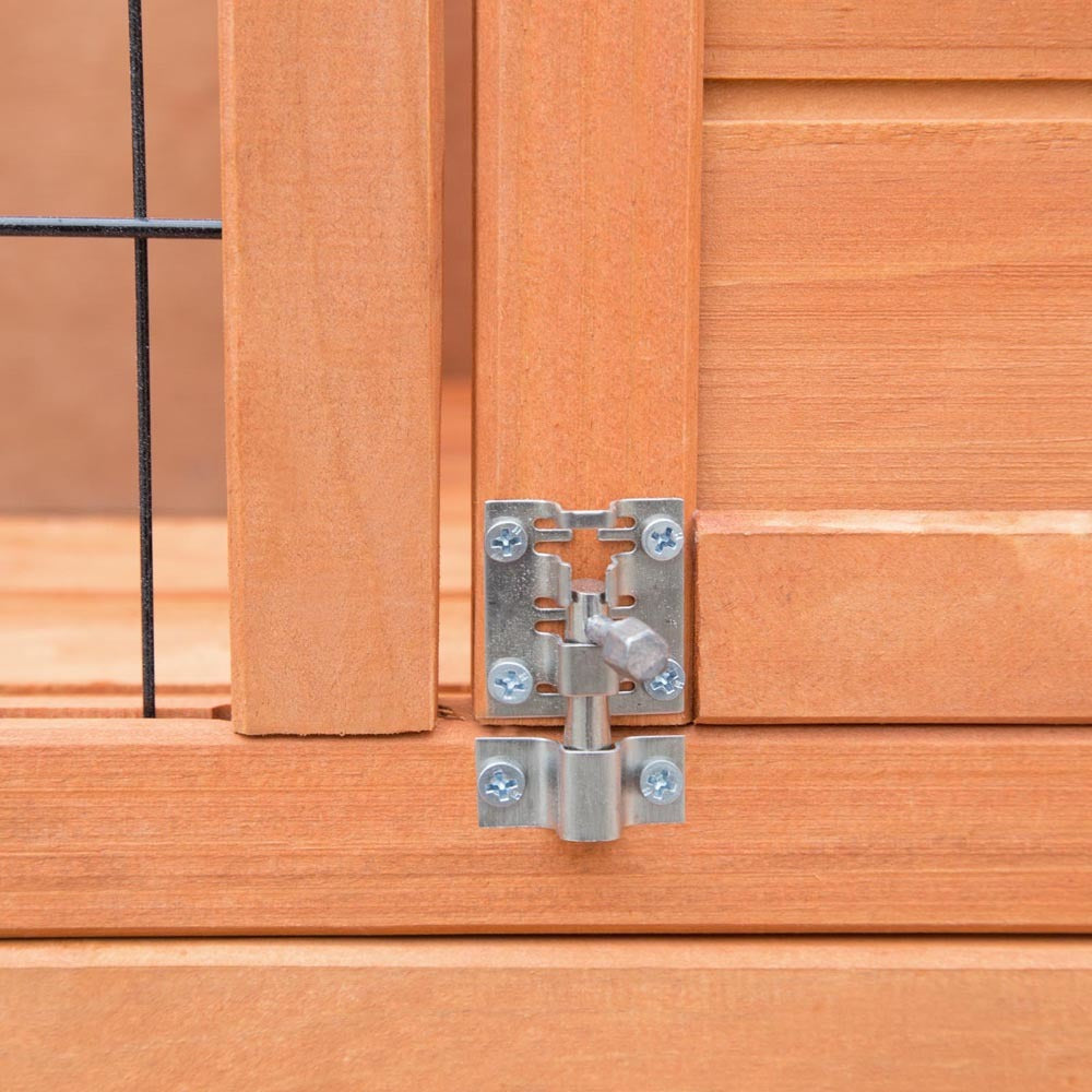 Metal hinge on a wooden door at Pet Servo