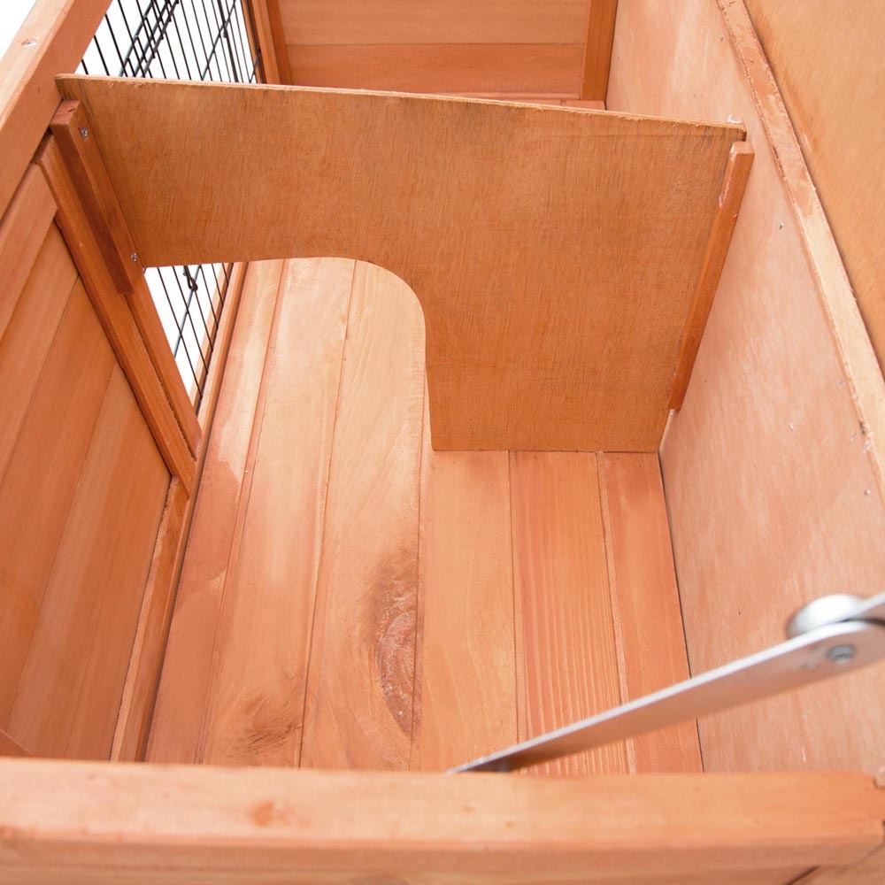 Wooden staircase with a metal railing inside a wooden structure at Pet Servo